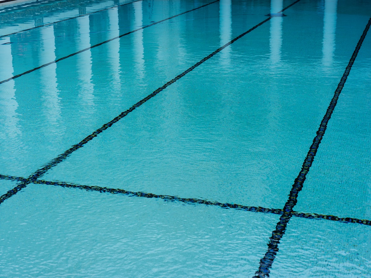 Tiled swimming pool with clear blue water