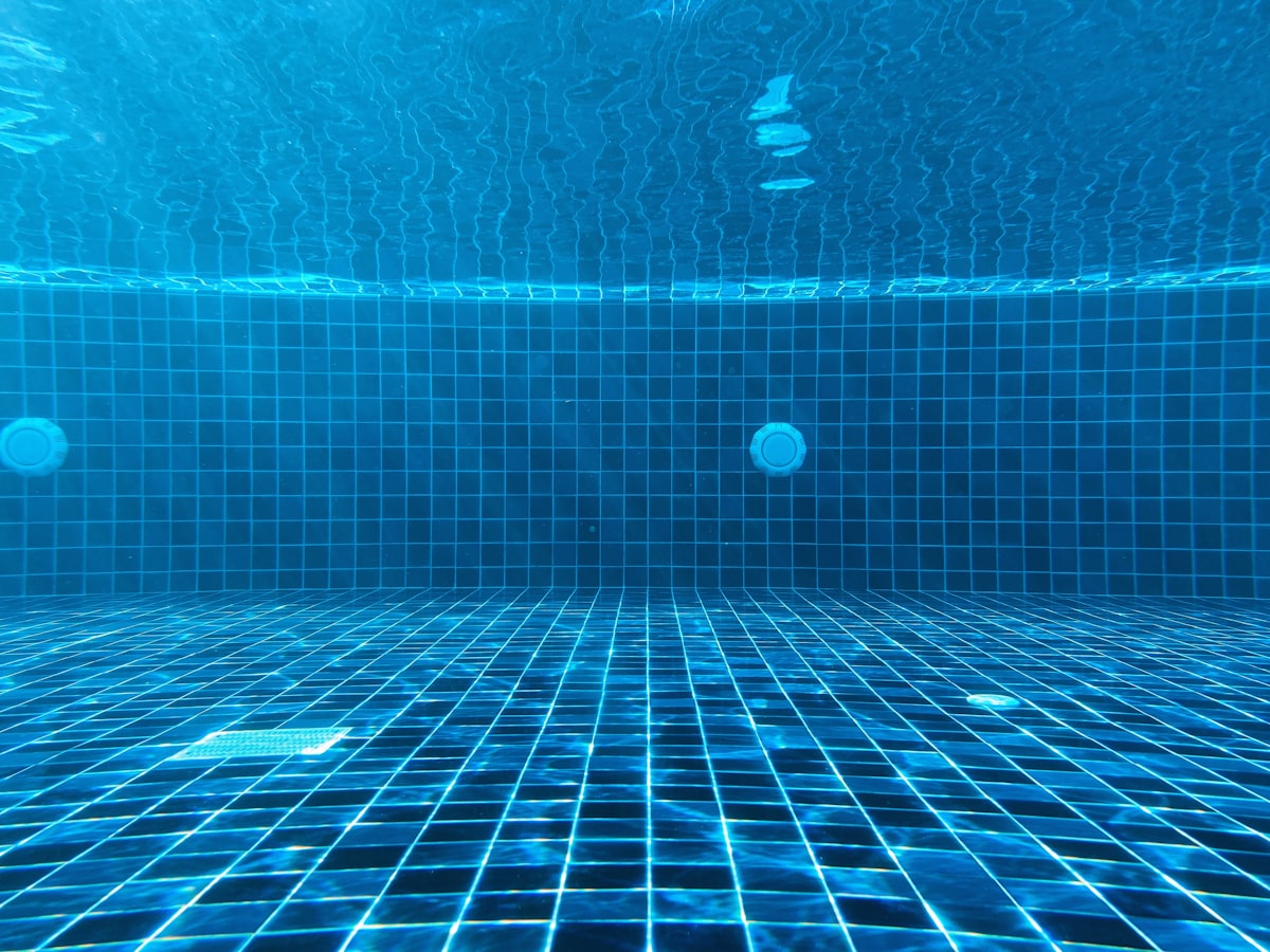 Clear blue swimming pool water viewed from above