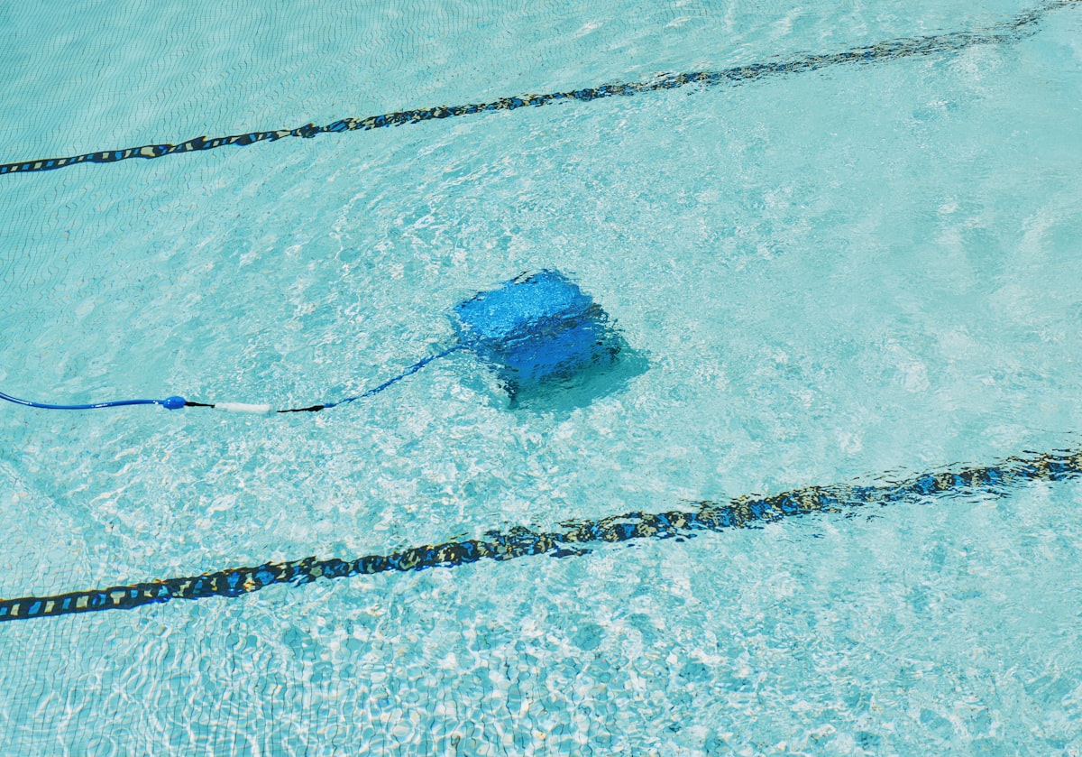 Robotic pool cleaner working underwater in a swimming pool